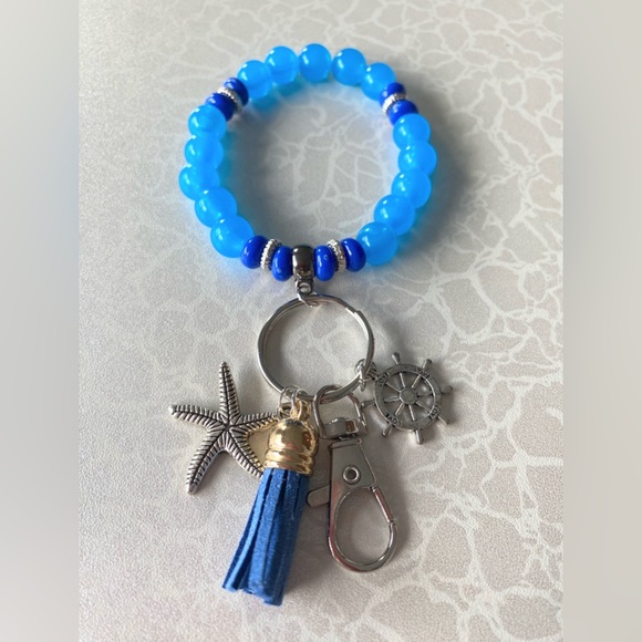 Blue Beaded Stretchable Wristlet Bracelet with Nautical Charm and Tassel - Picture 1 of 6